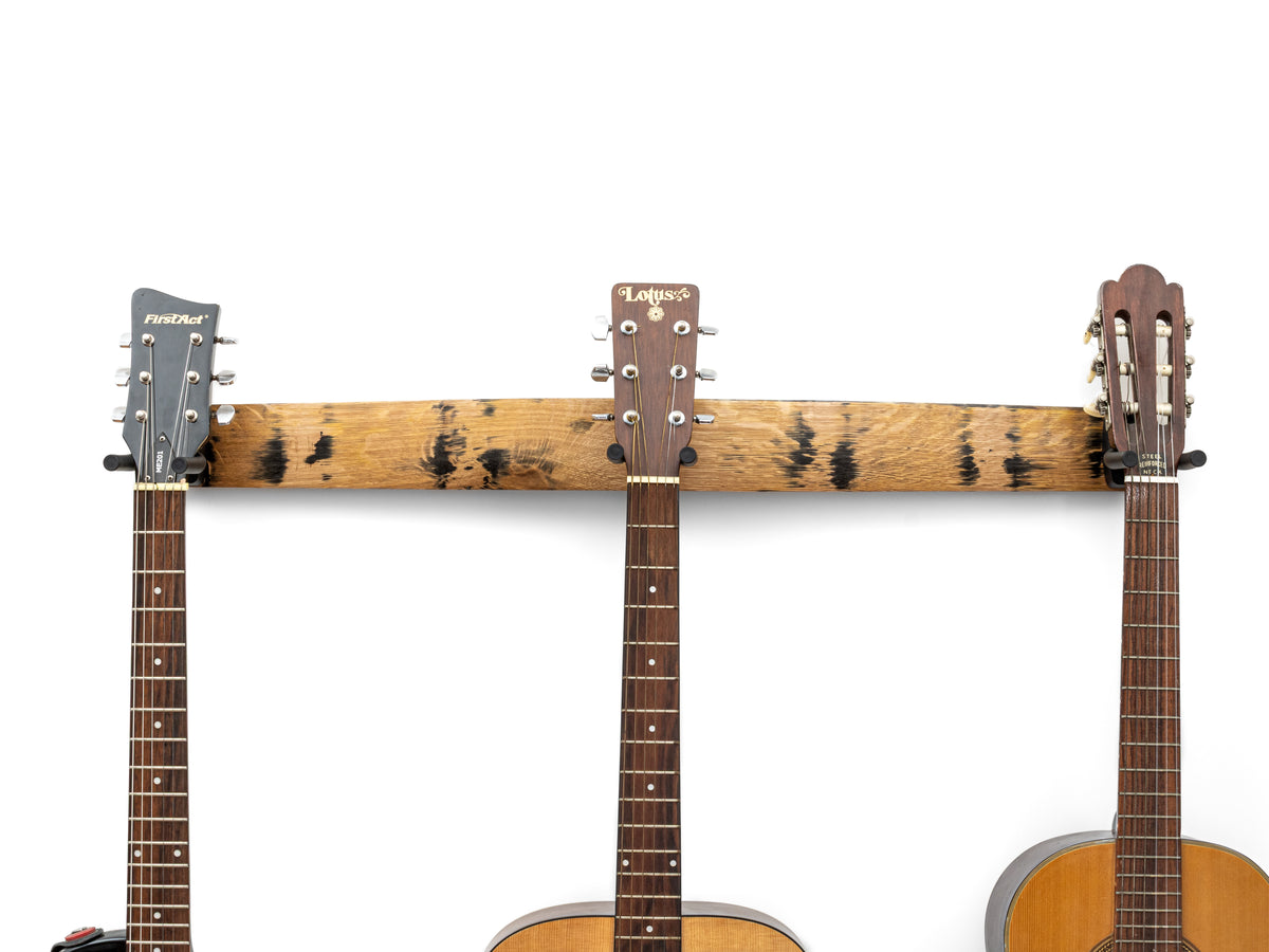 Natural finish 36-inch whiskey barrel stave triple guitar hanger without barrel hoop accents holding three guitars